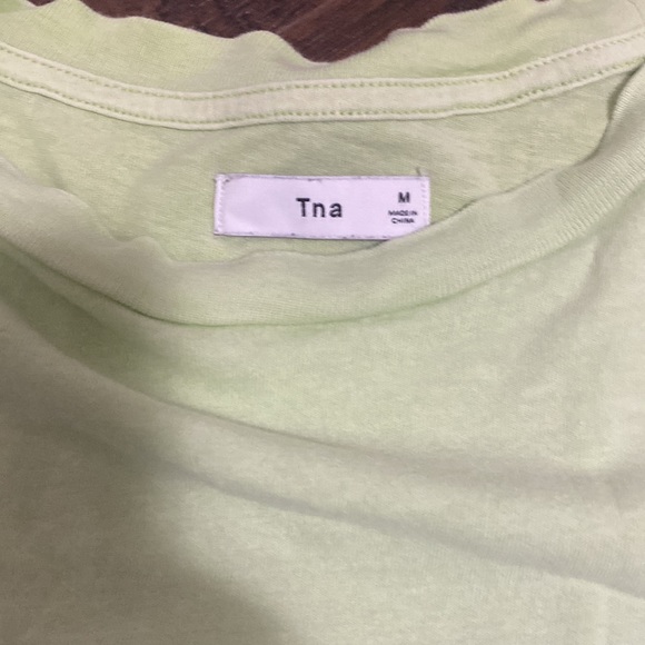 Selling the green Aritzia TNA green long sleeve, in size medium. - Picture 2 of 4